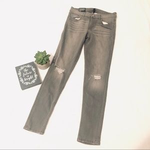 Grey distressed knee super skinny ankle jeans
